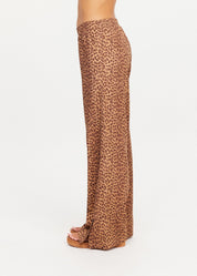 The Upside Javan Juliet Pant in leopard print, low rise with split hem detail side view