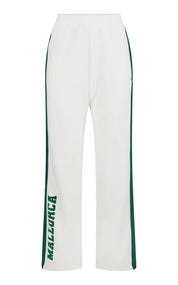 White pants with green accents and 'Malzurca' branding on a white background