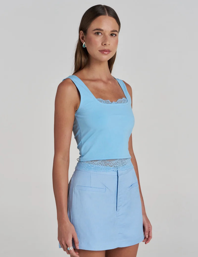 side view Model wearing the Summi Summi Ellidy Tank Top in Ocean with skort
