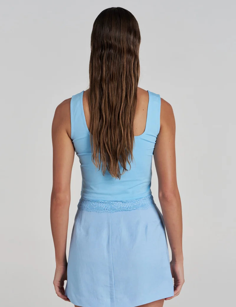 Model wearing the Summi Summi Ellidy Tank Top in Ocean with summi summi skort in ocean back view
