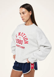 Side view of P.E Nation Backspin Sweat showing oversized fit