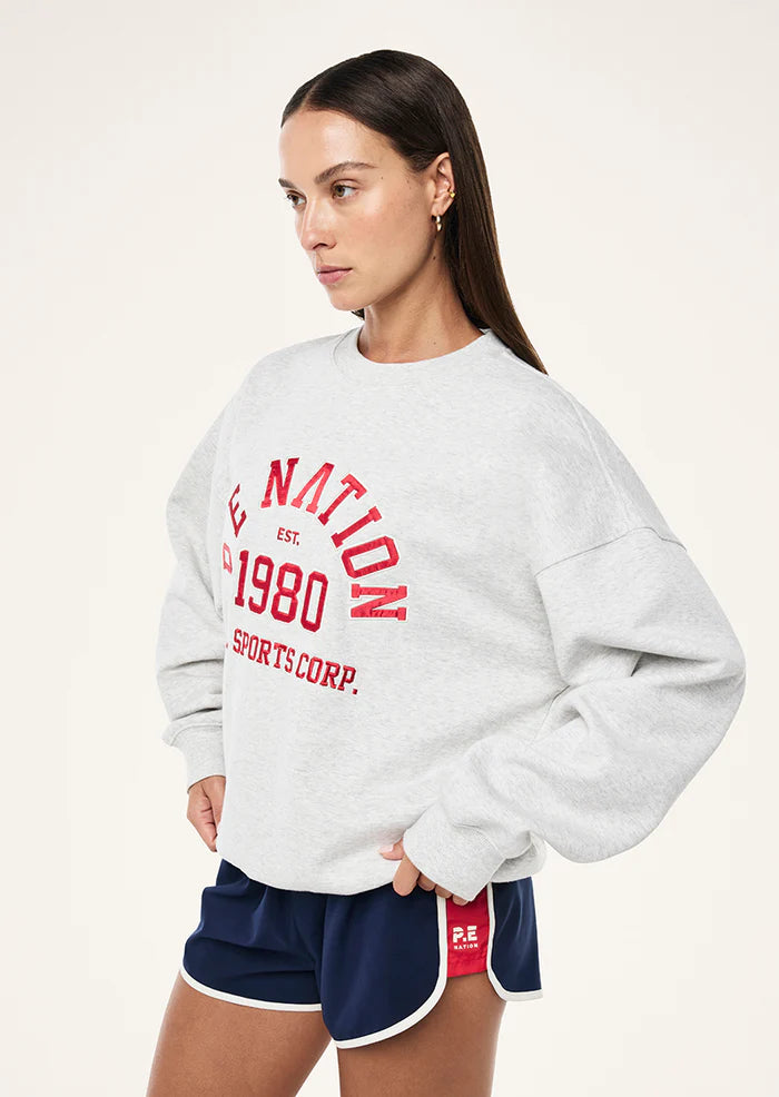 Side view of P.E Nation Backspin Sweat showing oversized fit