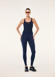 Womens activewear outfit styled with rib tank and bike shorts casual look