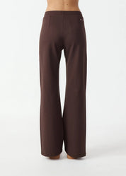 back view The Upside Petra flare pant in chocolate with pink stripe detail – Wild West Sisters
