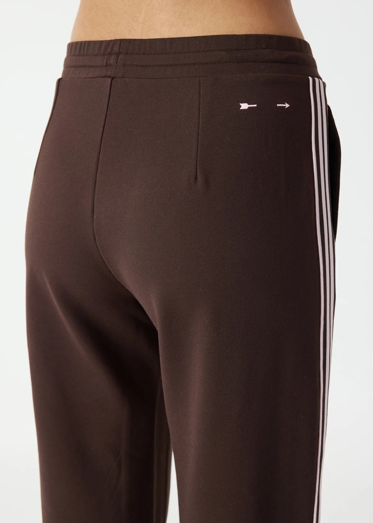 back view The Upside Petra flare pant in chocolate with pink stripe detail – Wild West Sisters