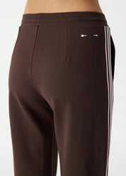 back view The Upside Petra flare pant in chocolate with pink stripe detail – Wild West Sisters