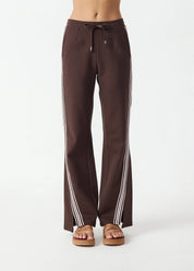 front view The Upside Petra flare pant in chocolate with pink stripe detail – Wild West Sisters