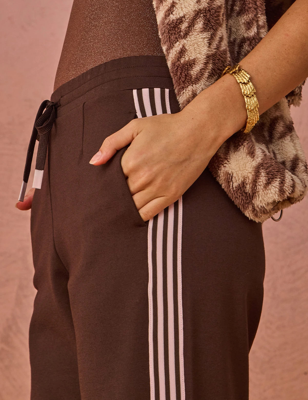 detail shot The Upside Petra flare pant in chocolate with pink stripe detail – Wild West Sisters