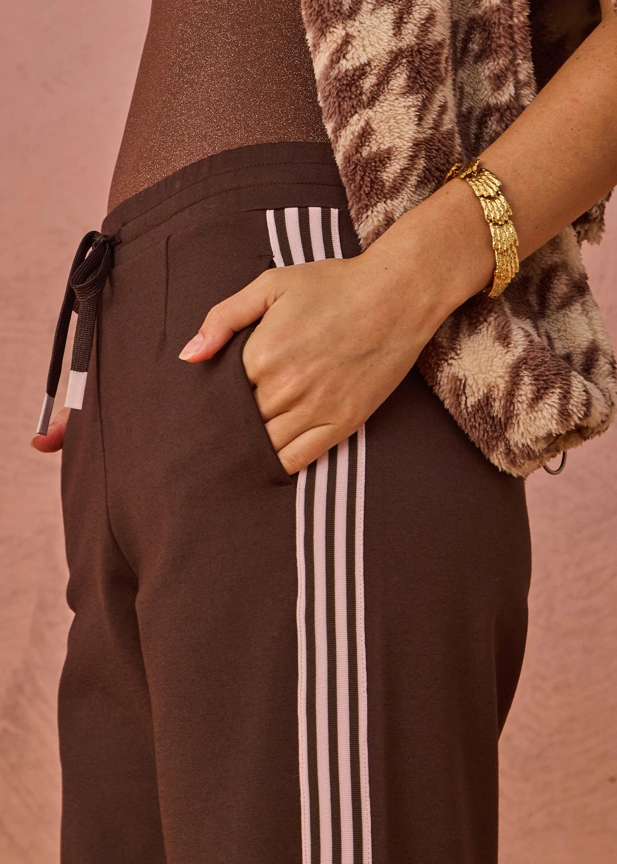 detail shot The Upside Petra flare pant in chocolate with pink stripe detail – Wild West Sisters