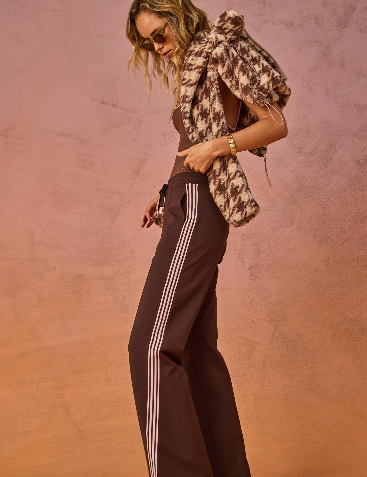 side view The Upside Petra flare pant in chocolate with pink stripe detail – Wild West Sisters