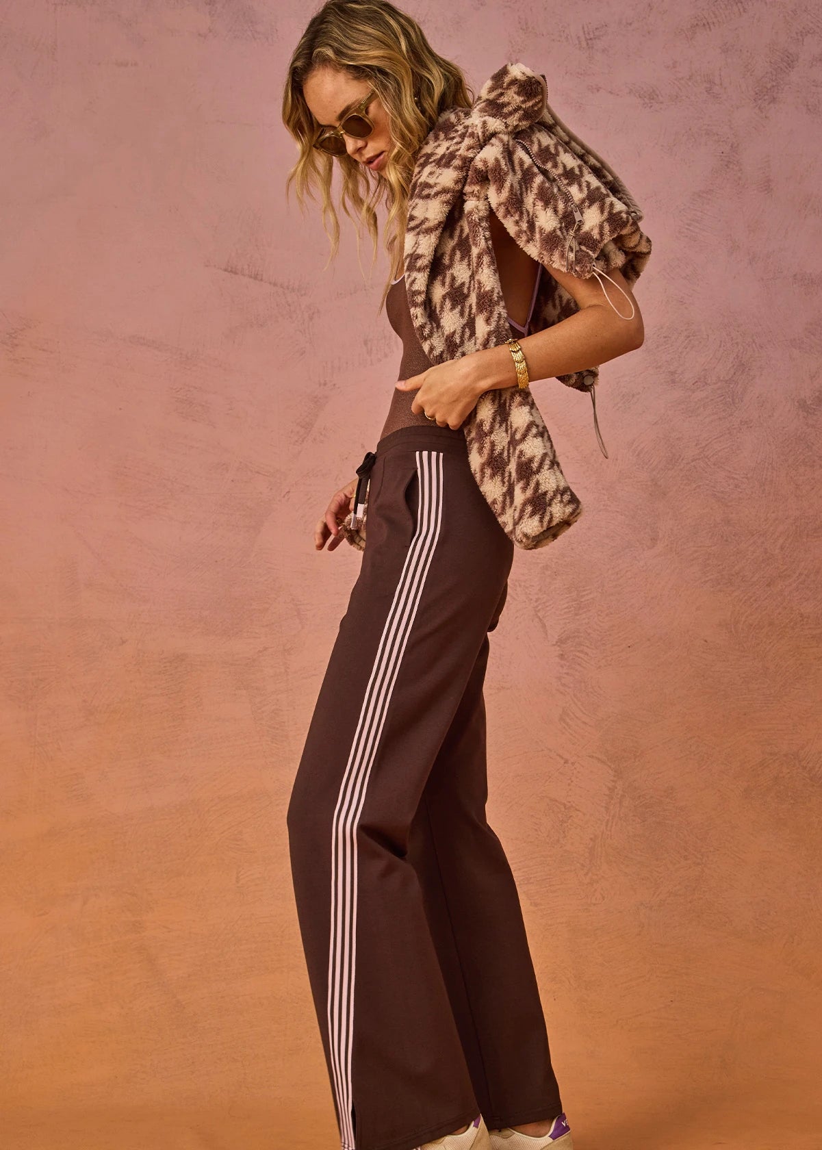 side view The Upside Petra flare pant in chocolate with pink stripe detail – Wild West Sisters