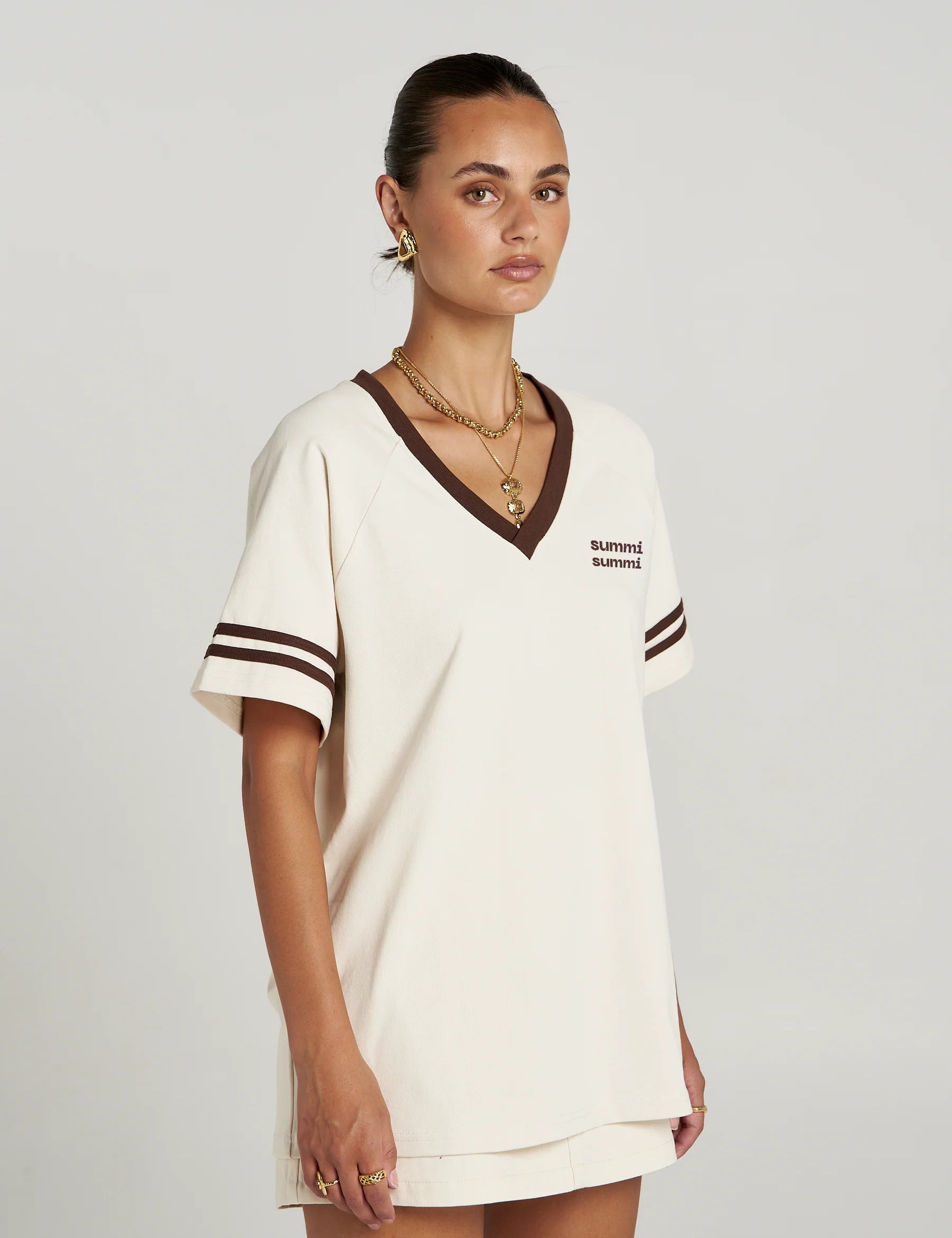 Model wearing Summi Summi Reverie V Neck styled with skirt