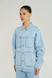 Model wearing Summi Summi La Vie Denim Jacket Icel Denim buttons closed