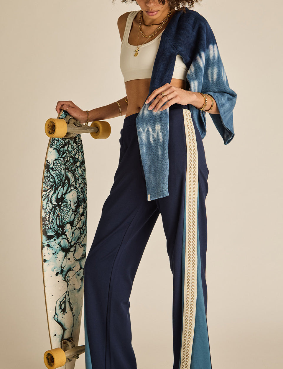 odel wearing The Upside Petra Flare Pant navy sporty flare trousers womens