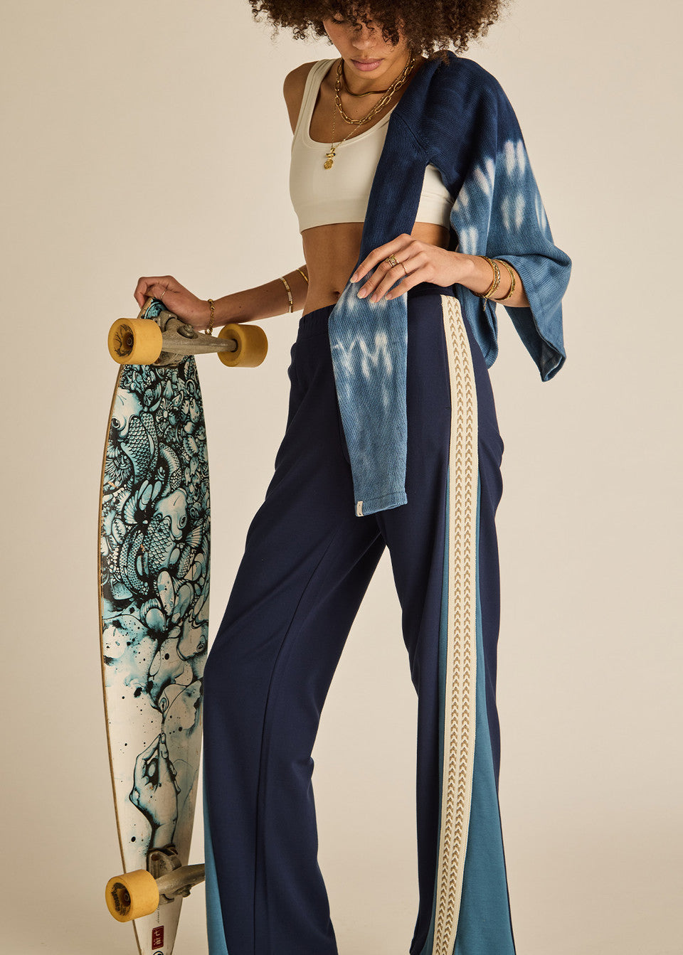 odel wearing The Upside Petra Flare Pant navy sporty flare trousers womens