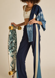 odel wearing The Upside Petra Flare Pant navy sporty flare trousers womens