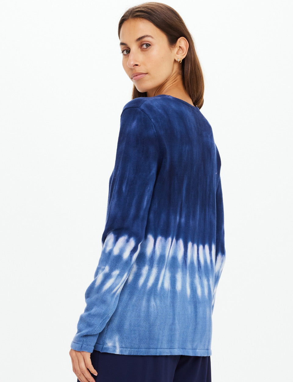 Model wearing The Upside Seeker Amana tie dye organic cotton knit sweater side
