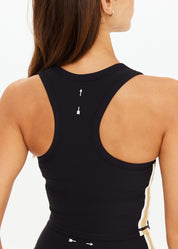 Back view of The Upside Arcadia Sophie Crop Top featuring printed cream arrow logo on racerback.”