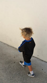Back view of Kids Twenty Two Tee, blue stripe sleeve detail, relaxed fit, Wild West Sisters
