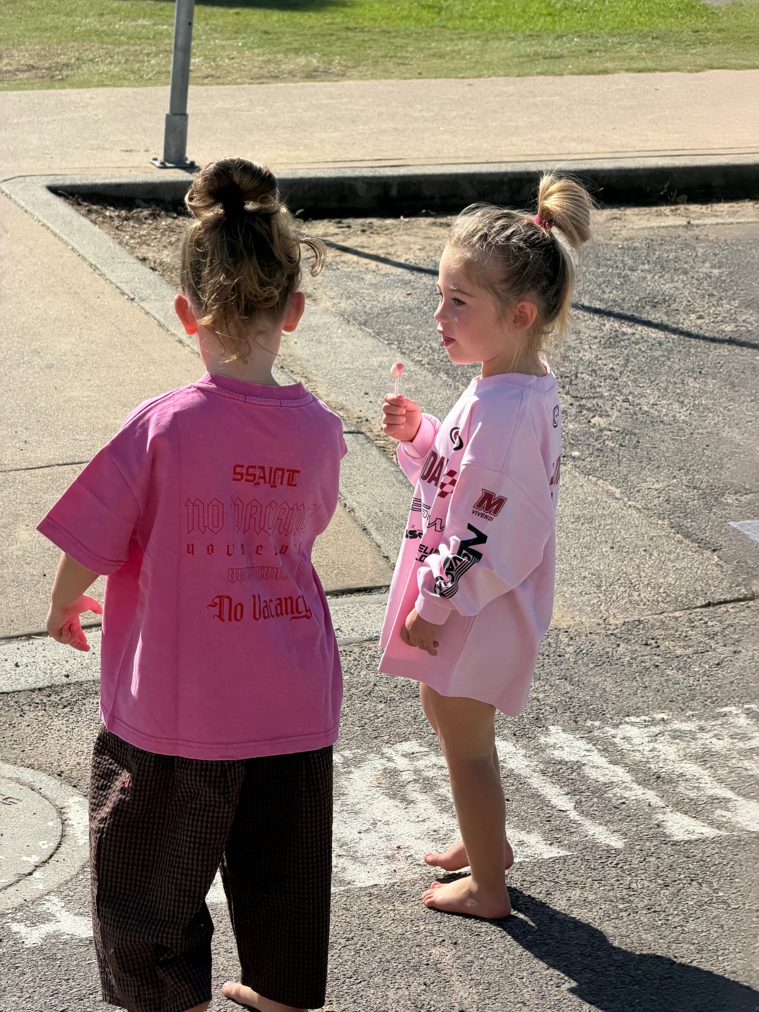 Child wearing Kids Moto Tee in pink, size 3-5, oversized relaxed fit, Wild West Sisters