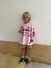Child wearing Kids Moto Tee in pink, size 5-7, oversized relaxed fit, Wild West Sisters