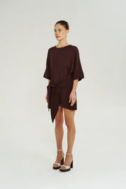 Model wearing Summi Summi Knit Tie Front Dress in Chocolat styled for an elevated day-to-night look.