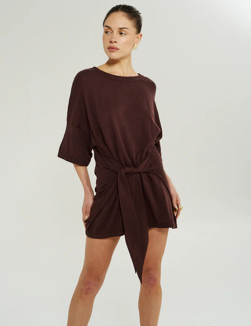 Close-up of adjustable wrap tie on Summi Summi Knit Tie Front Dress in Chocolat, worn tied at the waist.