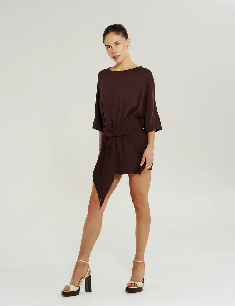 Side view of Summi Summi Knit Tie Front Dress in Chocolat showing wrap overlay and flattering mini silhouette.”