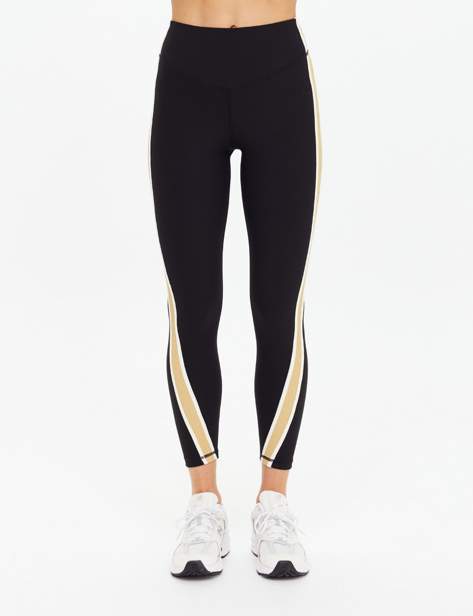 The Upside Arcadia 25in High Midi Pant in black with contrast tan side panels, high-rise sculpted fit.”