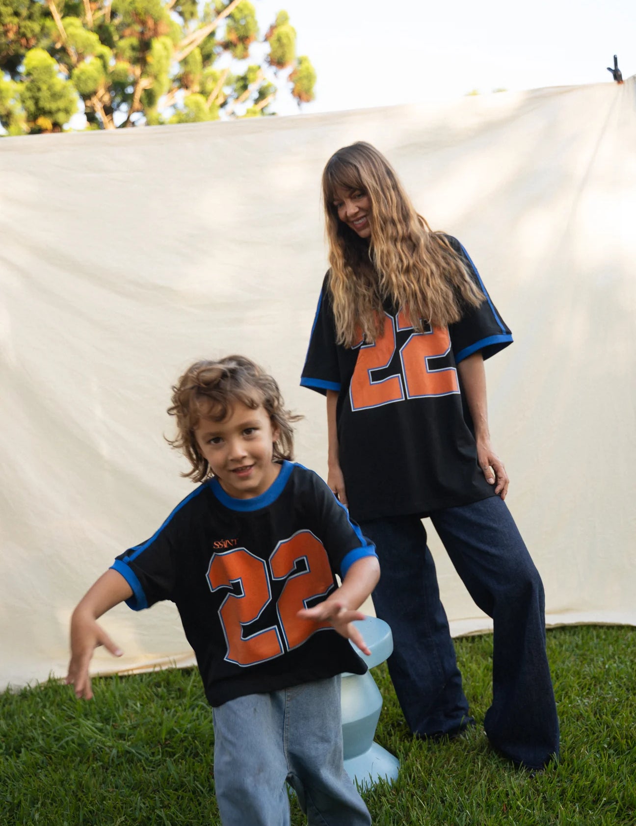 Kids Twenty Two Tee in black with bold orange 22 graphic, Wild West Sisters