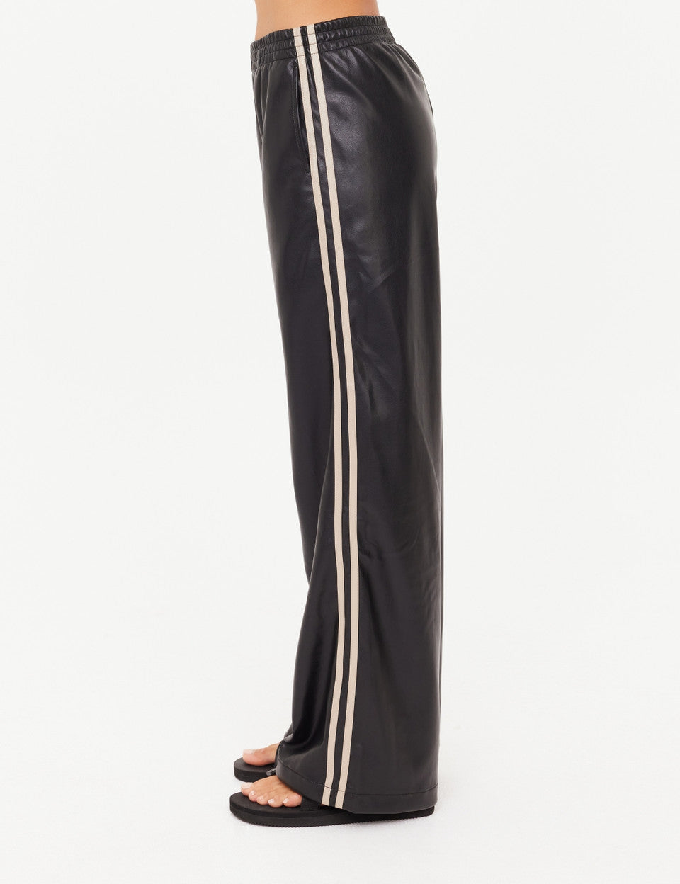 Black leather pants with white stripes on a white background
