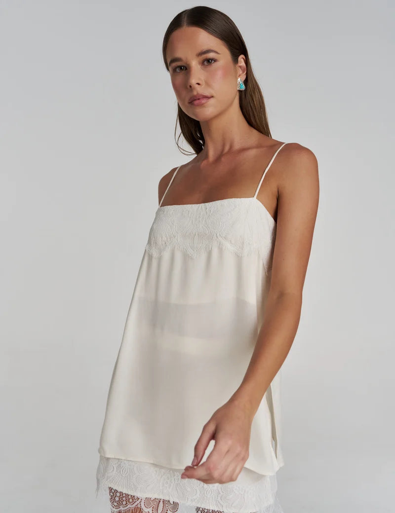 Model wearing the Summi Summi Florence Mini Skirt in WhiteWITH MATCHING FLORENCE TOP IN WHITE